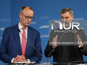 Friedrich Merz, CDU Federal Chairman and CDU/CSU Parliamentary Group Leader, and Markus Soder, the Prime Minister of Bavaria (CSU), speak to...