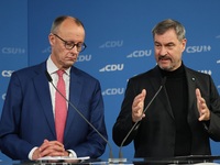 Friedrich Merz, CDU Federal Chairman and CDU/CSU Parliamentary Group Leader, and Markus Soder, the Prime Minister of Bavaria (CSU), speak to...