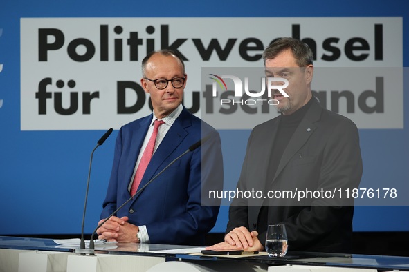 Friedrich Merz, CDU Federal Chairman and CDU/CSU Parliamentary Group Leader, and Markus Soder, the Prime Minister of Bavaria (CSU), speak to...