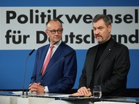 Friedrich Merz, CDU Federal Chairman and CDU/CSU Parliamentary Group Leader, and Markus Soder, the Prime Minister of Bavaria (CSU), speak to...