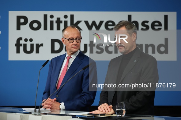 Friedrich Merz, CDU Federal Chairman and CDU/CSU Parliamentary Group Leader, and Markus Soder, the Prime Minister of Bavaria (CSU), speak to...