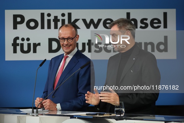 Friedrich Merz, CDU Federal Chairman and CDU/CSU Parliamentary Group Leader, and Markus Soder, the Prime Minister of Bavaria (CSU), speak to...