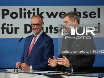 Friedrich Merz, CDU Federal Chairman and CDU/CSU Parliamentary Group Leader, and Markus Soder, the Prime Minister of Bavaria (CSU), speak to...