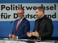 Friedrich Merz, CDU Federal Chairman and CDU/CSU Parliamentary Group Leader, and Markus Soder, the Prime Minister of Bavaria (CSU), speak to...