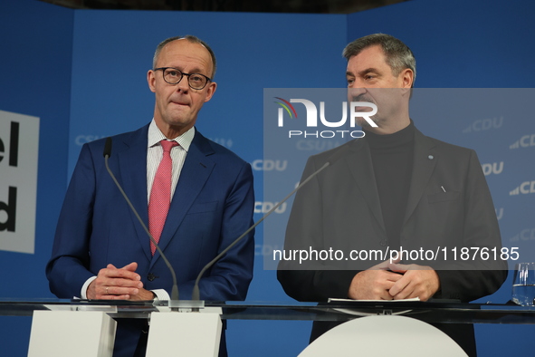 Friedrich Merz, CDU Federal Chairman and CDU/CSU Parliamentary Group Leader, and Markus Soder, the Prime Minister of Bavaria (CSU), speak to...