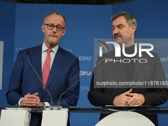 Friedrich Merz, CDU Federal Chairman and CDU/CSU Parliamentary Group Leader, and Markus Soder, the Prime Minister of Bavaria (CSU), speak to...