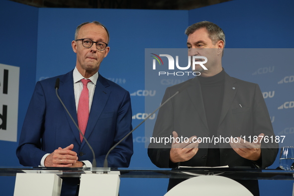 Friedrich Merz, CDU Federal Chairman and CDU/CSU Parliamentary Group Leader, and Markus Soder, the Prime Minister of Bavaria (CSU), speak to...