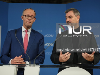 Friedrich Merz, CDU Federal Chairman and CDU/CSU Parliamentary Group Leader, and Markus Soder, the Prime Minister of Bavaria (CSU), speak to...