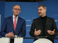 Friedrich Merz, CDU Federal Chairman and CDU/CSU Parliamentary Group Leader, and Markus Soder, the Prime Minister of Bavaria (CSU), speak to...