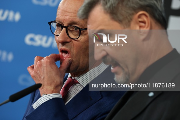 Friedrich Merz, CDU Federal Chairman and CDU/CSU Parliamentary Group Leader, and Markus Soder, the Prime Minister of Bavaria (CSU), speak to...