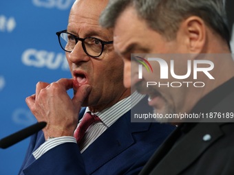 Friedrich Merz, CDU Federal Chairman and CDU/CSU Parliamentary Group Leader, and Markus Soder, the Prime Minister of Bavaria (CSU), speak to...