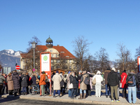 A busy winter day occurs at Garmisch-Partenkirchen Train Station in Bavaria, Germany, on December 13, 2024. Travelers gather at a bus stop n...