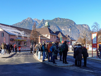 A busy winter day occurs at Garmisch-Partenkirchen Train Station in Bavaria, Germany, on December 13, 2024. Travelers gather at a bus stop n...