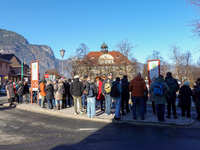 A busy winter day occurs at Garmisch-Partenkirchen Train Station in Bavaria, Germany, on December 13, 2024. Travelers gather at a bus stop n...