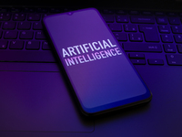 The text ''Artificial Intelligence (AI)'' appears on a smartphone screen in this illustration photo in Reno, United States, on December 17,...