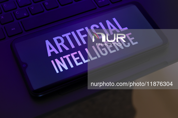 The text ''Artificial Intelligence (AI)'' appears on a smartphone screen in this illustration photo in Reno, United States, on December 17,...