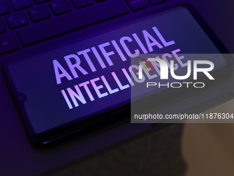 The text ''Artificial Intelligence (AI)'' appears on a smartphone screen in this illustration photo in Reno, United States, on December 17,...