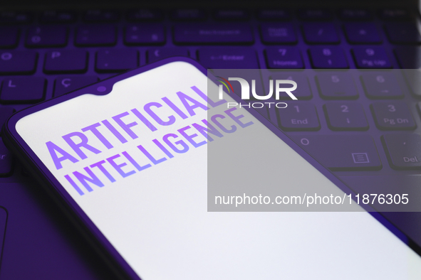 The text ''Artificial Intelligence (AI)'' appears on a smartphone screen in this illustration photo in Reno, United States, on December 17,...