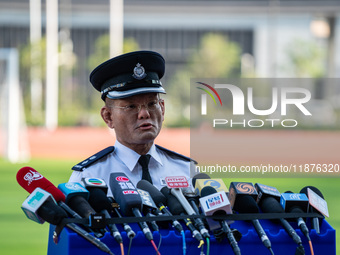 Inter-department Counter Terrorism Unit Senior Superintendent, Leung Wai Kei, speaks to the media at Kai Tak Sports Park in Hong Kong on Dec...