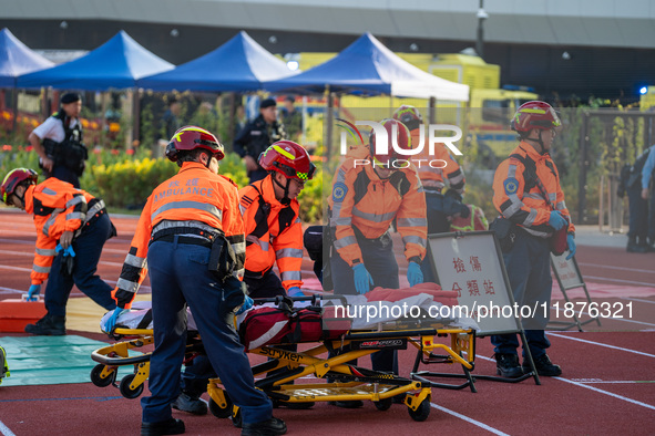 Paramedics participate in a counter-terrorism exercise at Kai Tak Sports Park in Hong Kong on December 17, 2024. 