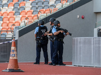 Police officers stand guard at Kai Tak Sports Park during a counter-terrorism exercise in Hong Kong, on December 17, 2024. (