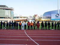 Members of different government departments pose for a group photo at Kai Tak Sports Park during a counter-terrorism exercise in Hong Kong,...