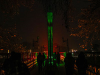 People walk over the river Jhelum bridge on a cold evening in Srinagar, Jammu and Kashmir, on December 17, 2024. Cold wave conditions intens...