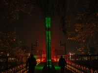 People walk over the river Jhelum bridge on a cold evening in Srinagar, Jammu and Kashmir, on December 17, 2024. Cold wave conditions intens...