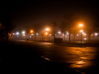 A person walks through dense fog that covers Liberty State Park following rainfall in Jersey City, NJ, U.S., on December 16, 2024. (