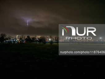 Part of the New York City skyline is seen through dense fog covering Liberty State Park following rainfall in Jersey City, NJ, U.S., on Dece...