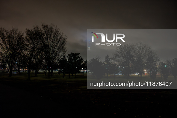 Part of the New York City skyline is seen through dense fog covering Liberty State Park following rainfall in Jersey City, NJ, U.S., on Dece...