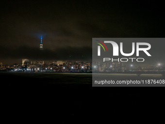 Part of the New York City skyline is seen through dense fog covering Liberty State Park following rainfall in Jersey City, NJ, U.S., on Dece...