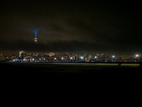 Part of the New York City skyline is seen through dense fog covering Liberty State Park following rainfall in Jersey City, NJ, U.S., on Dece...