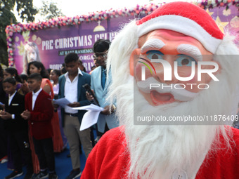 A Protestant Christian man dressed as Santa Claus attends a pre-Christmas celebration in Kolkata, India, on December 17, 2024. Protestantism...