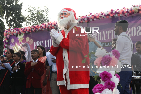 A Protestant Christian man dressed as Santa Claus attends a pre-Christmas celebration in Kolkata, India, on December 17, 2024. Protestantism...