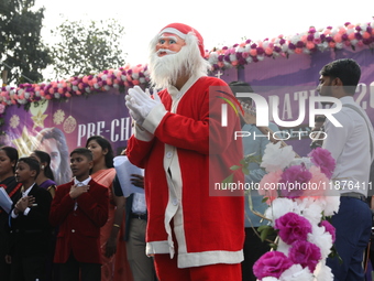 A Protestant Christian man dressed as Santa Claus attends a pre-Christmas celebration in Kolkata, India, on December 17, 2024. Protestantism...