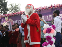 A Protestant Christian man dressed as Santa Claus attends a pre-Christmas celebration in Kolkata, India, on December 17, 2024. Protestantism...