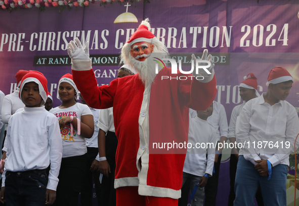 A Protestant Christian man dressed as Santa Claus attends a pre-Christmas celebration in Kolkata, India, on December 17, 2024. Protestantism...