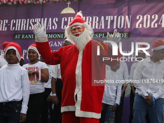 A Protestant Christian man dressed as Santa Claus attends a pre-Christmas celebration in Kolkata, India, on December 17, 2024. Protestantism...