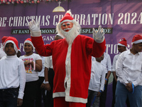 A Protestant Christian man dressed as Santa Claus attends a pre-Christmas celebration in Kolkata, India, on December 17, 2024. Protestantism...