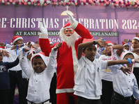 Protestant Christian children perform during a pre-Christmas celebration in Kolkata, India, on December 17, 2024. Protestantism is a branch...