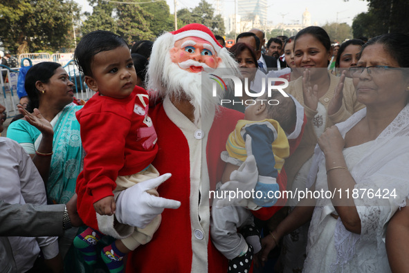 A Protestant Christian man dressed as Santa Claus attends a pre-Christmas celebration in Kolkata, India, on December 17, 2024. Protestantism...