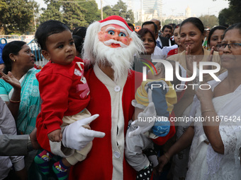 A Protestant Christian man dressed as Santa Claus attends a pre-Christmas celebration in Kolkata, India, on December 17, 2024. Protestantism...