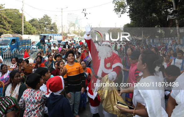 A Protestant Christian man dressed as Santa Claus attends a pre-Christmas celebration in Kolkata, India, on December 17, 2024. Protestantism...