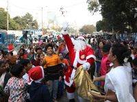 A Protestant Christian man dressed as Santa Claus attends a pre-Christmas celebration in Kolkata, India, on December 17, 2024. Protestantism...