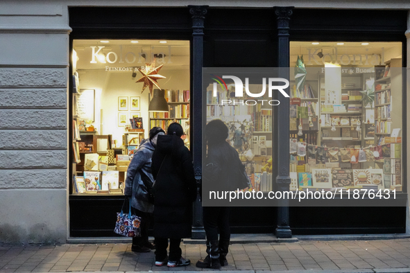 People are outside on the streets in Augsburg, Bavaria, Germany, on December 14, 2024, looking for gifts and presents. 