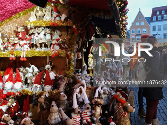 People are outside on the streets in Augsburg, Bavaria, Germany, on December 14, 2024, looking for gifts and presents. (