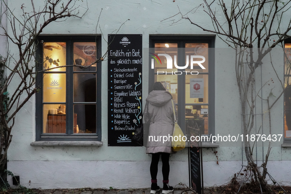 People are outside on the streets in Augsburg, Bavaria, Germany, on December 14, 2024, looking for gifts and presents. 