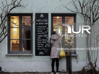 People are outside on the streets in Augsburg, Bavaria, Germany, on December 14, 2024, looking for gifts and presents. (