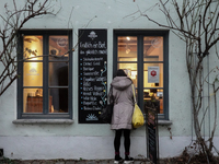 People are outside on the streets in Augsburg, Bavaria, Germany, on December 14, 2024, looking for gifts and presents. (